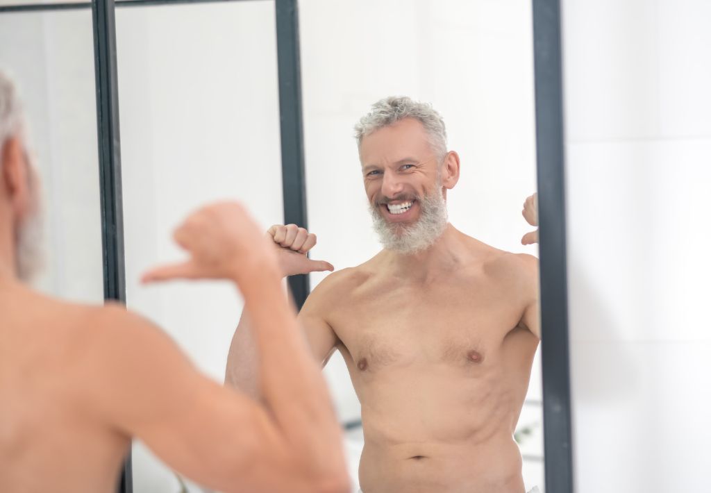 an older man with a beard is totally pumped and pointing at himself because his erection works again thanks to his recent p-shot pittsburgh.